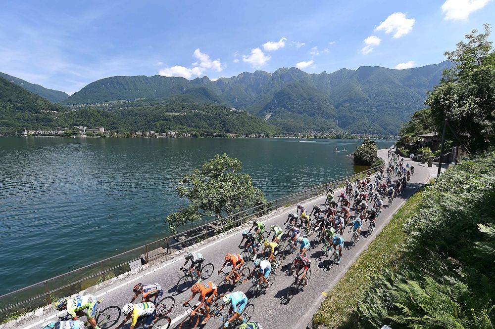 The peloton rides through the Italian countryside during stage 18.