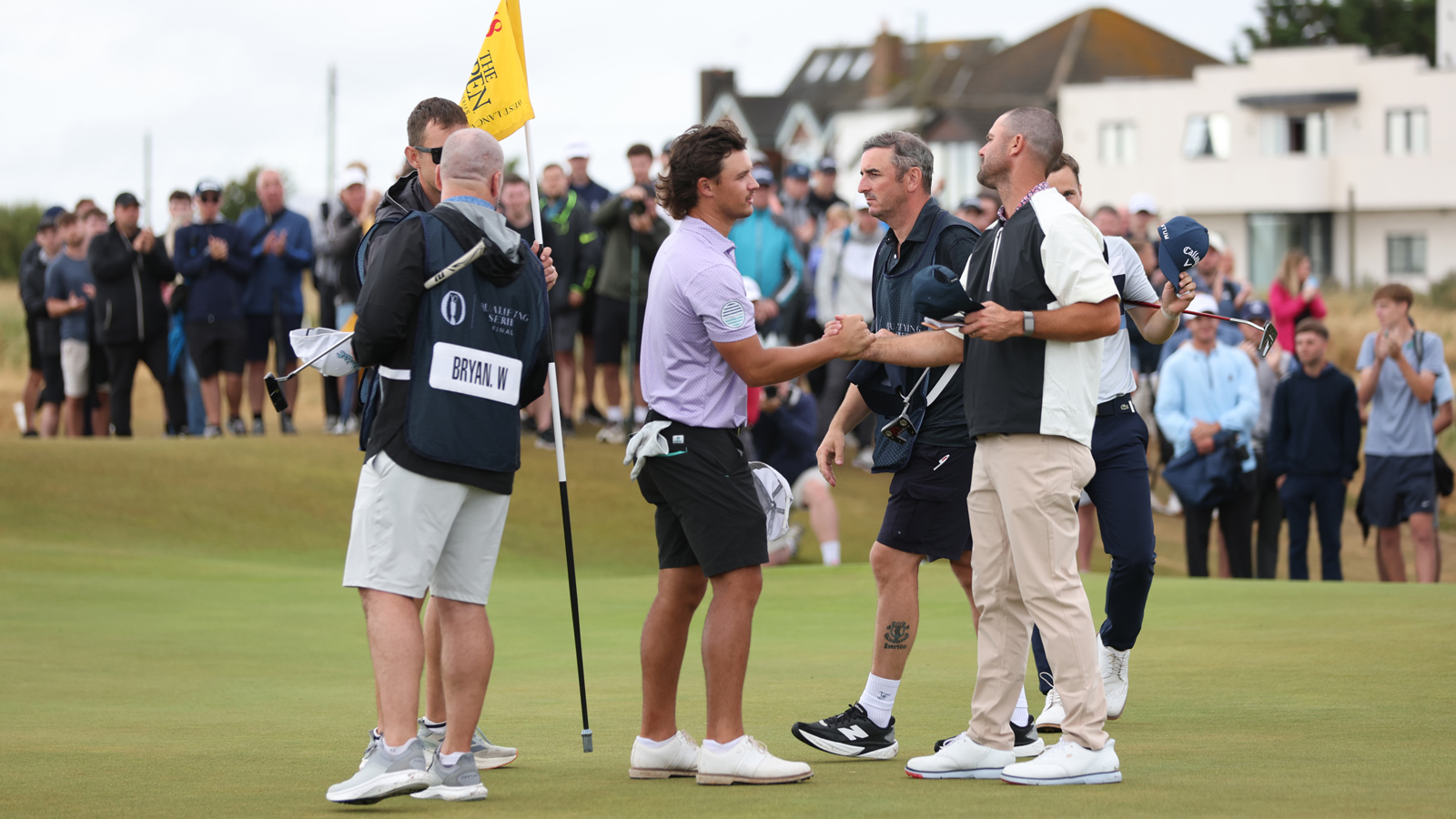 Golfers shake hands on the green