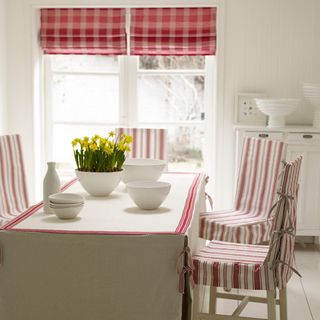 dining room with table and roman blinds