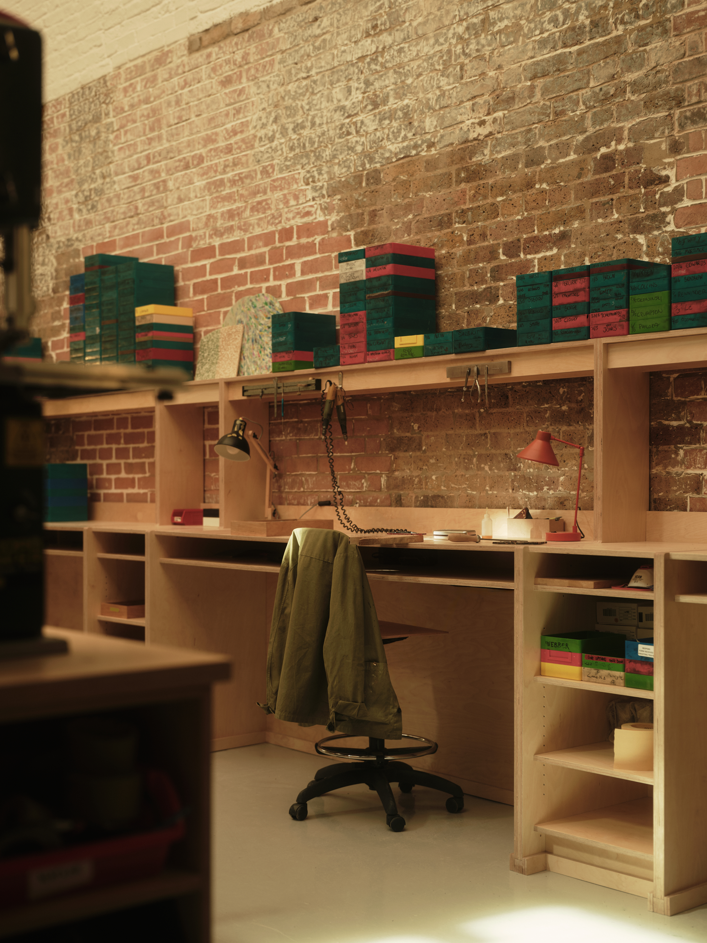 new Cubitts headquarters interior, refurbished warehouse type building with raw materiality and colour pops