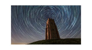 Star trails around Glastonbury Tor in Somerset, England, captured by astrophotographer Josh Dury