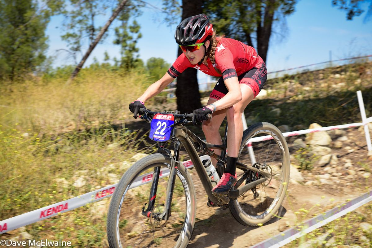 Kate Courtney (Specialized) riding in the top ten on lap three