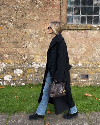 Girl in a coat with bottega bag