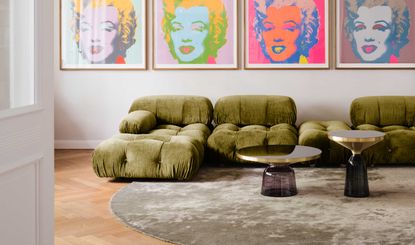 a green camaleonda sofa in a colorful living room