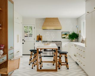 A neutral kitchen with white and green flooring