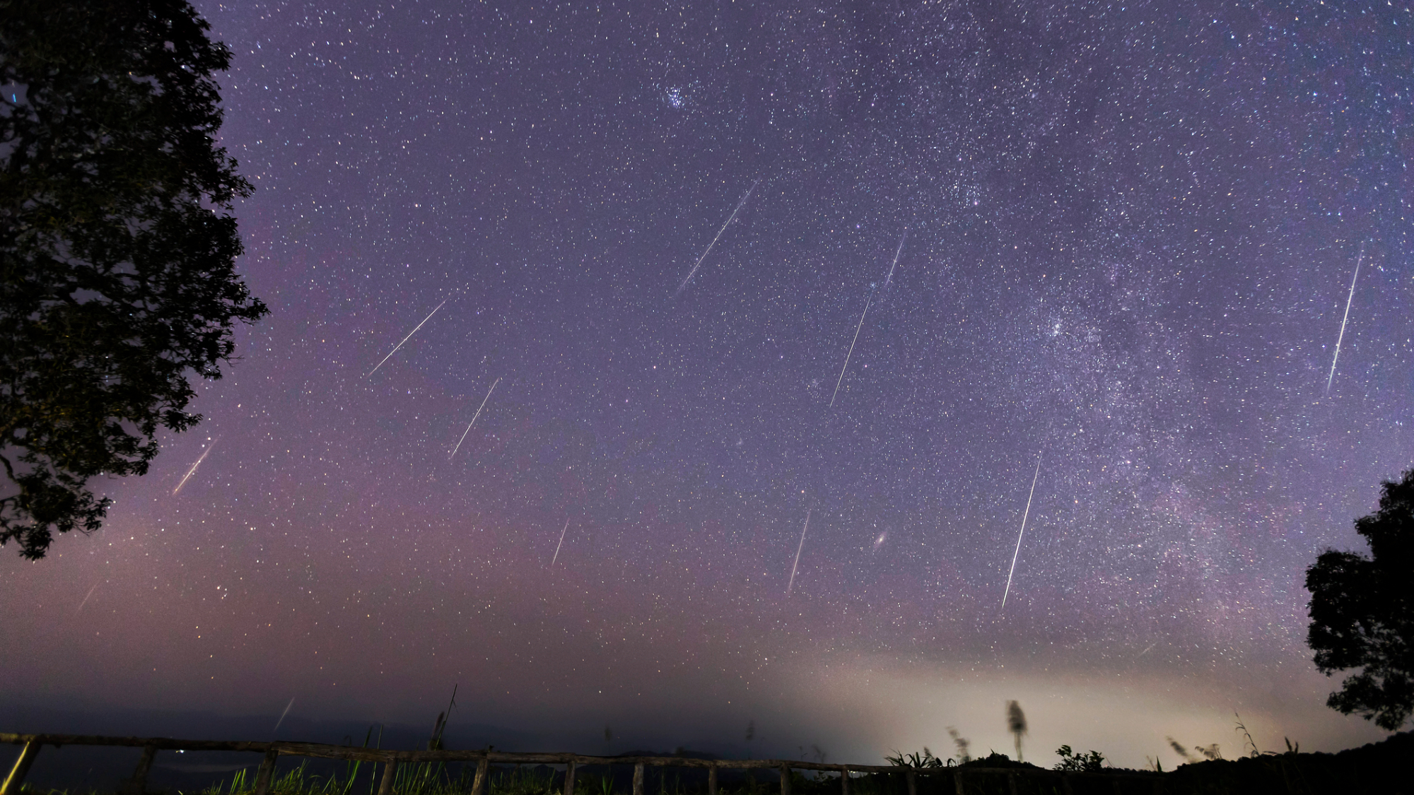 Geminid Meteor Shower and the Milky Way Over a mountain. Geminid Meteor in the night sky