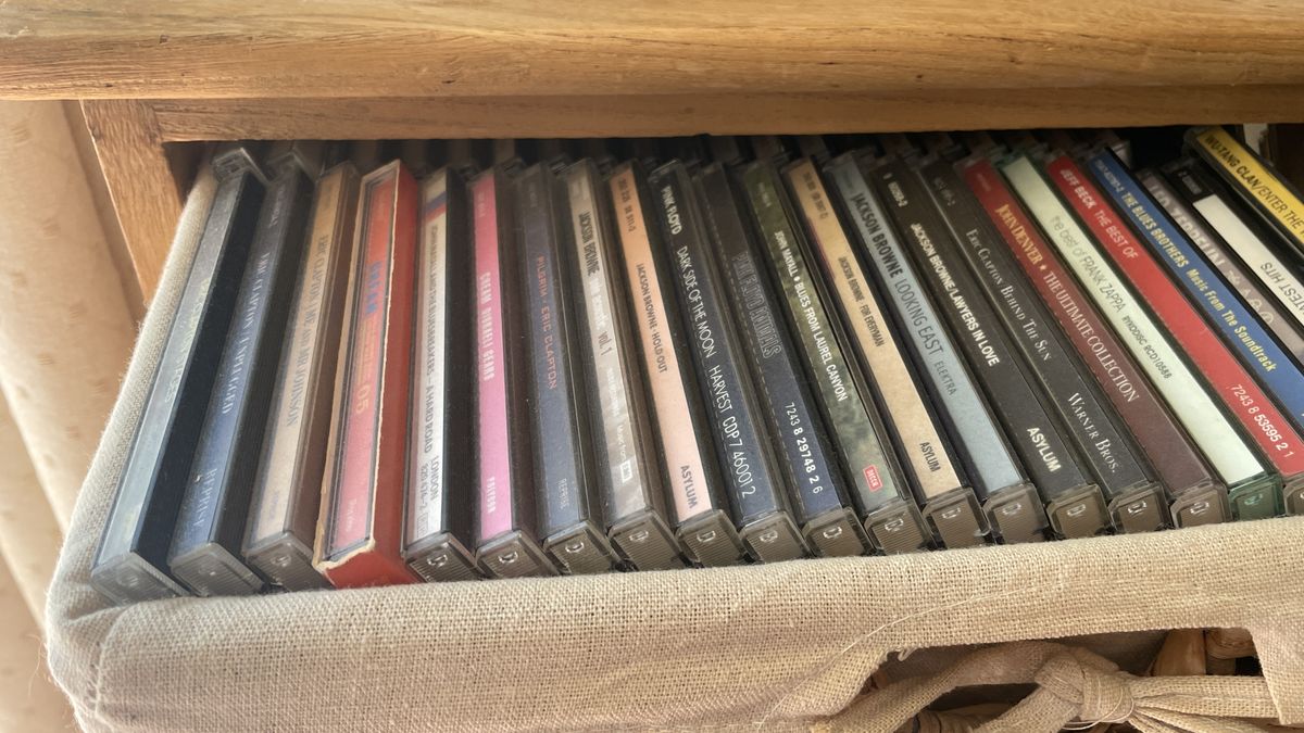 A car's CD player and burned CDs, on a hot day