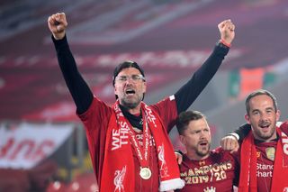 Liverpool manager Jurgen Klopp celebrates during the Premier League trophy presentation at Anfield in July 2022.