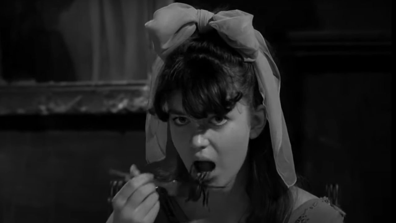 Jill Banner as Virginia eating a spider in Spider Baby, Or The Maddest Story Ever Told