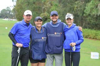 Nelly Korda of The United States poses for a photograph with her father Petr Korda and their caddies Jason McDede and Caroline McDede