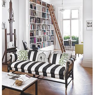 living room with sofa with black and white stripes