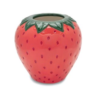 A red strawberry vase with dots and a green rim