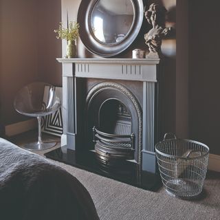 A bedroom with a tweed-effect grey carpet and grey painted walls