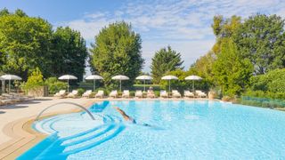 The plush swimming pool at luxury hotel and spa Chateau Saint Martin in Saint Paul de Vence