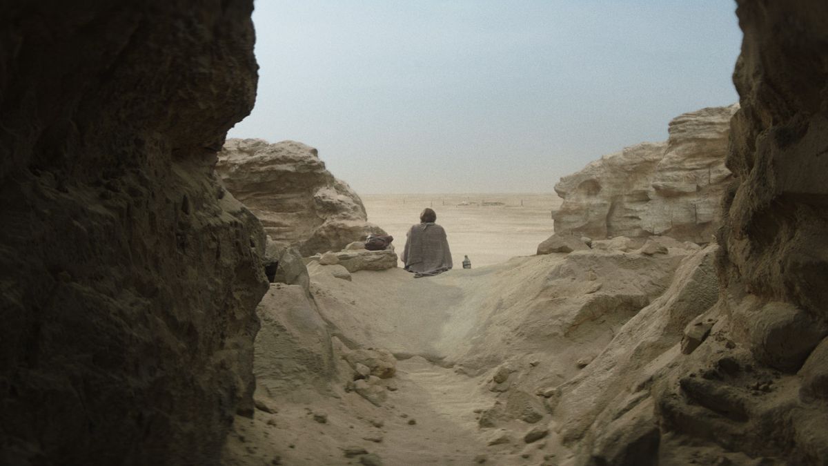 Obi-Wan Kenobi sitting in the desert