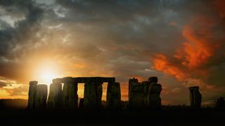 Sun rising over Stonehenge, Wiltshire, United Kingdom