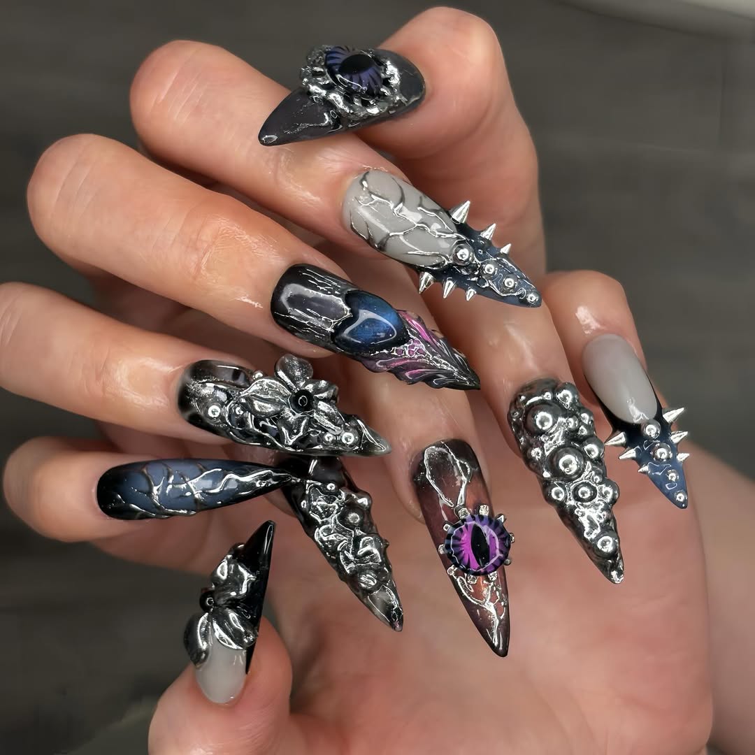 halloween manicure with black base and chrome accents