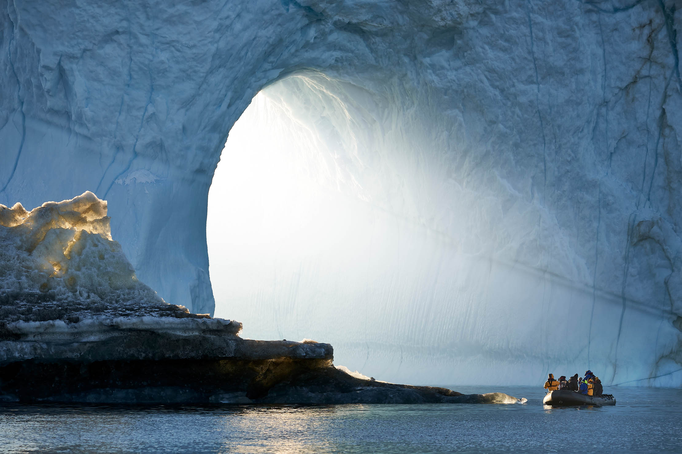 Rafting among the icebergs at Scoresbysund, Eastern Greenland.