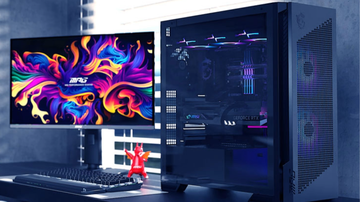A monitor on a desk next to an MPG Velox 300R Airflow PZ case from MSI.