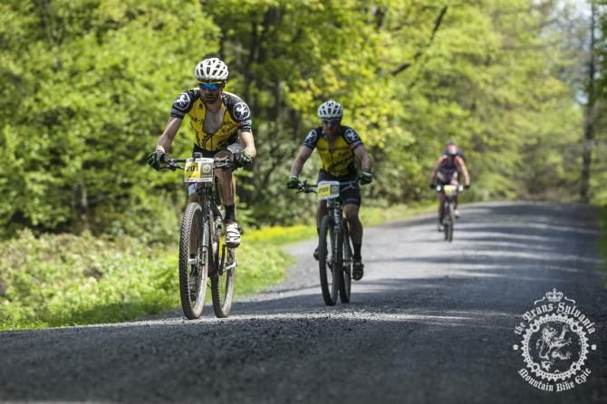 Mike Festa and Craig Lebair hit the gravel betw een the singletrack sections of the Trans- Sylvania Epic