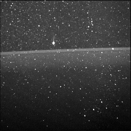 The star-tracker camera aboard NASA’s Juno spacecraft captured this view of Jupiter’s faint rings on Aug. 27, 2016, during the probe’s first data-gathering close approach to the giant planet. It’s the first-ever view of the rings from inside of them. The bright star above the main ring is Betelgeuse, and Orion’s belt can be seen in the lower right.