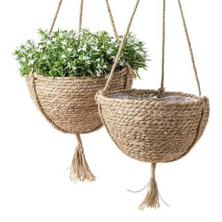 two seagrass hanging planters by La Jolie Muse on white background