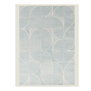 A cream rug with blue swirled pattern