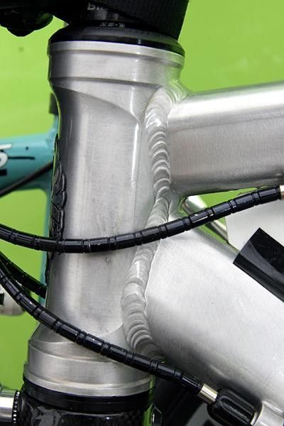 The unpainted frame exposes tidy welding