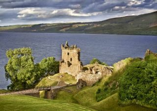 Urquhart Castle sitting in front of Loch Ness, one of the family days out to be had in Scotland