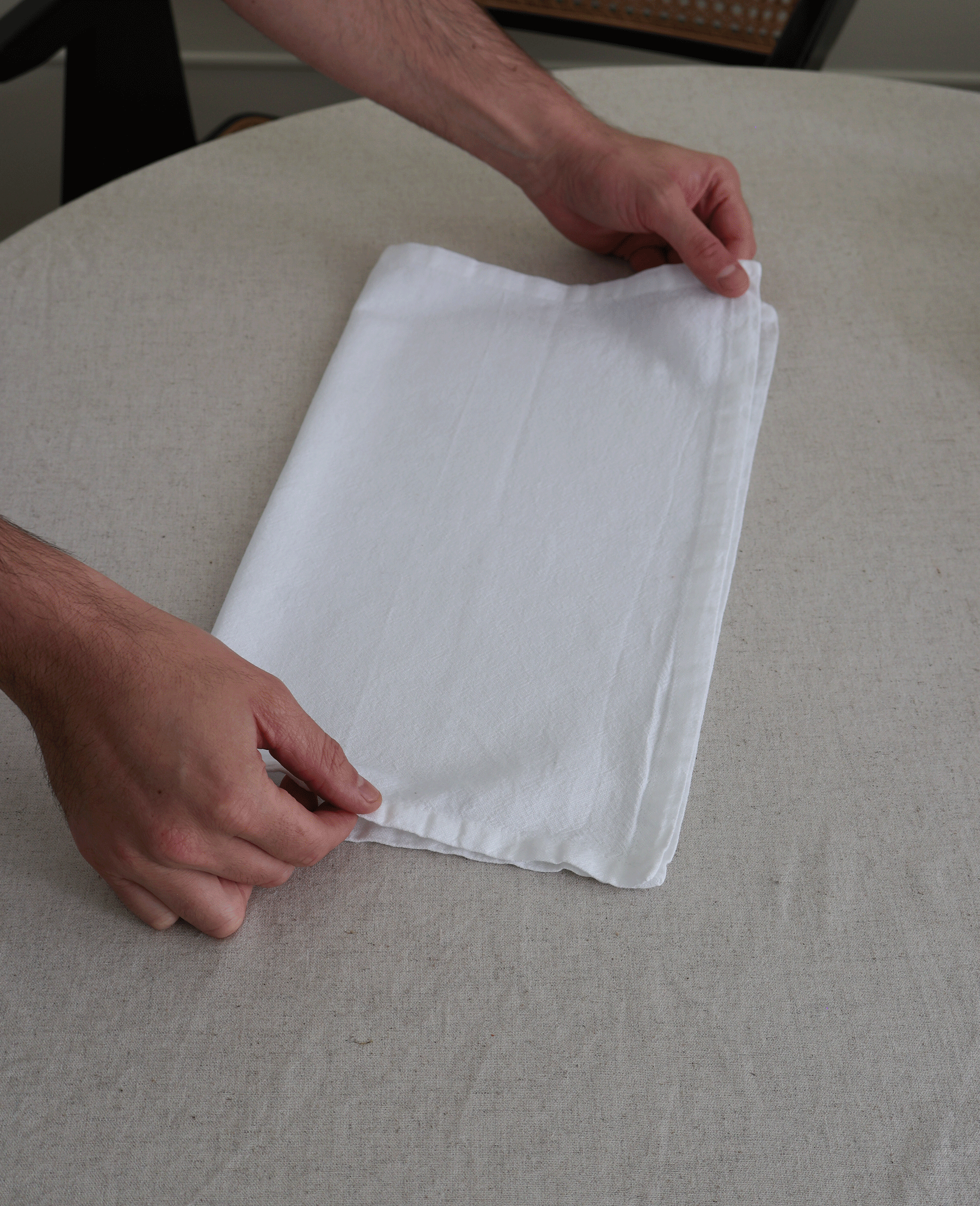 step by step photos of folding a napkin