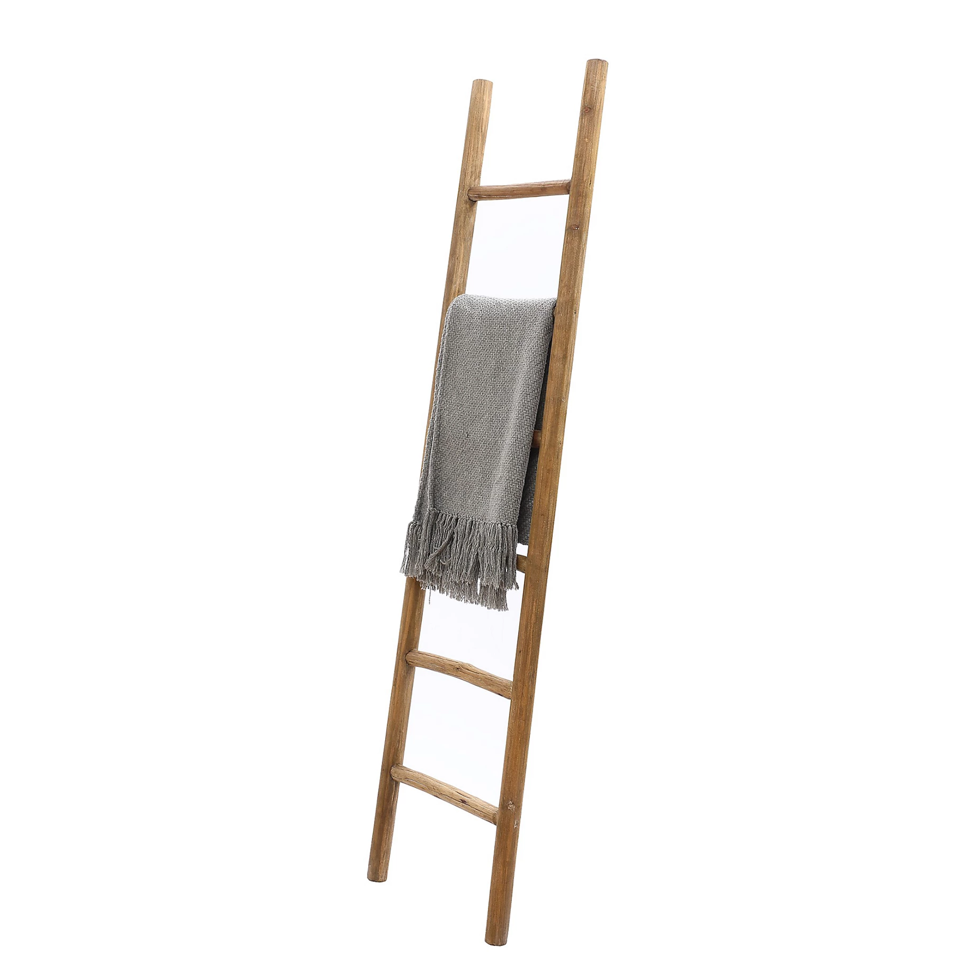 a decorative ladder holding a blanket