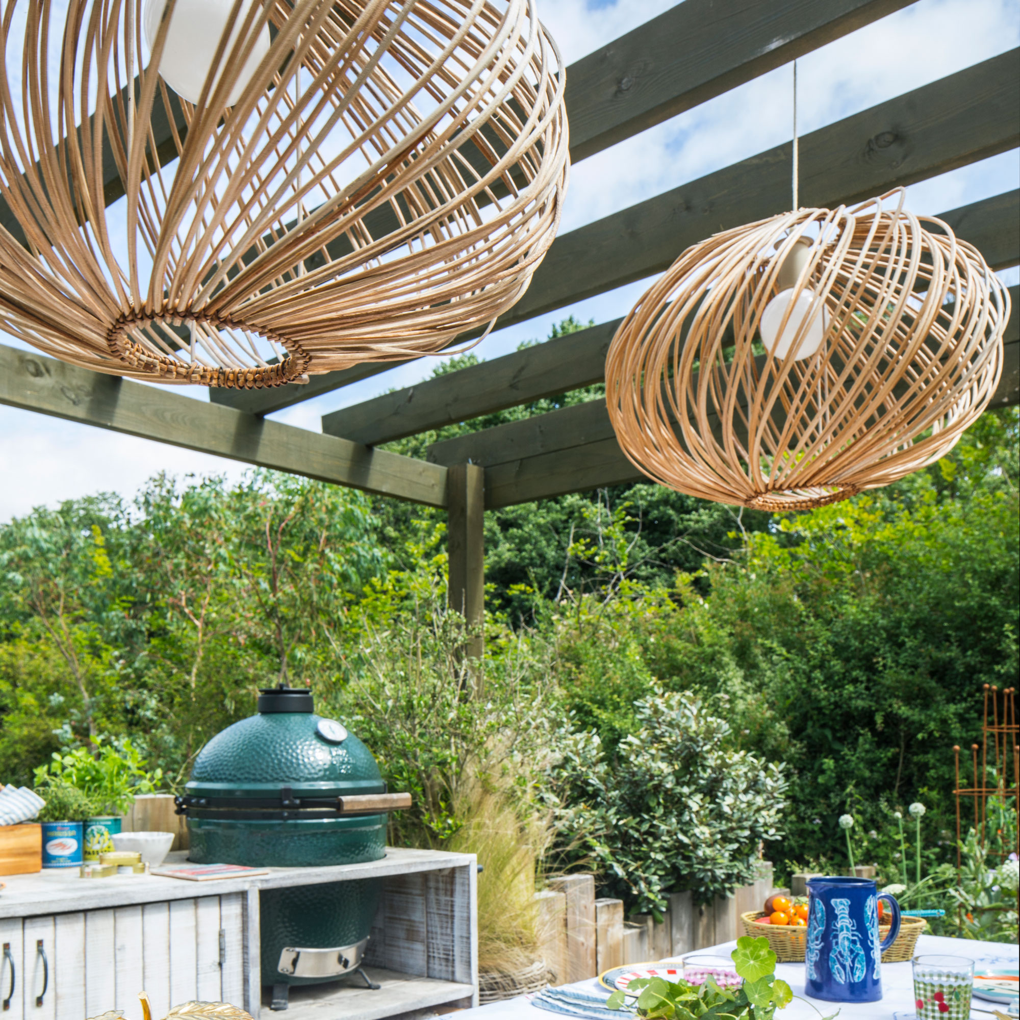 Rattan lights hanging from a pergola