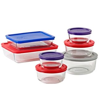 A set of round and rectangular glass food storage containers with red, blue and purple lids