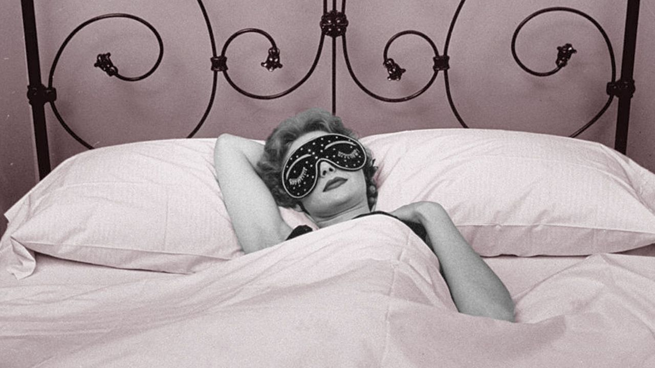 Woman wearing sleep mask getting beauty sleep