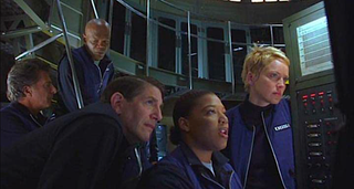 A still from "Sphere" showing five scientists in an undersea lab.
