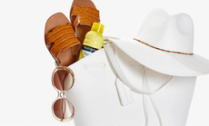 A selection of items available from Nordstrom Rack including sandals, a sunhat, sunglasses and sunscreen.