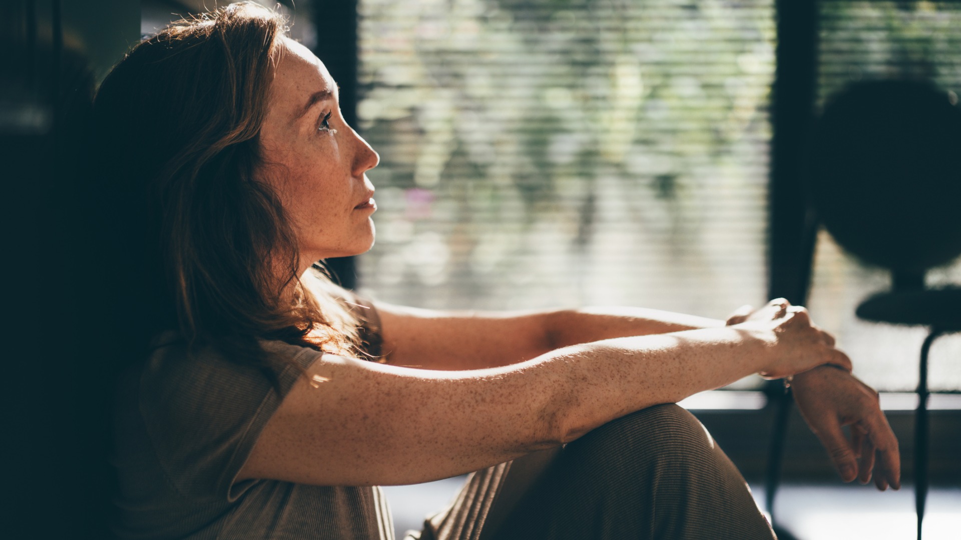 Woman sat on the floor contemplating