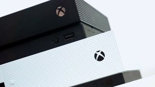 Image of Xbox One X stacked on top of Xbox One S.