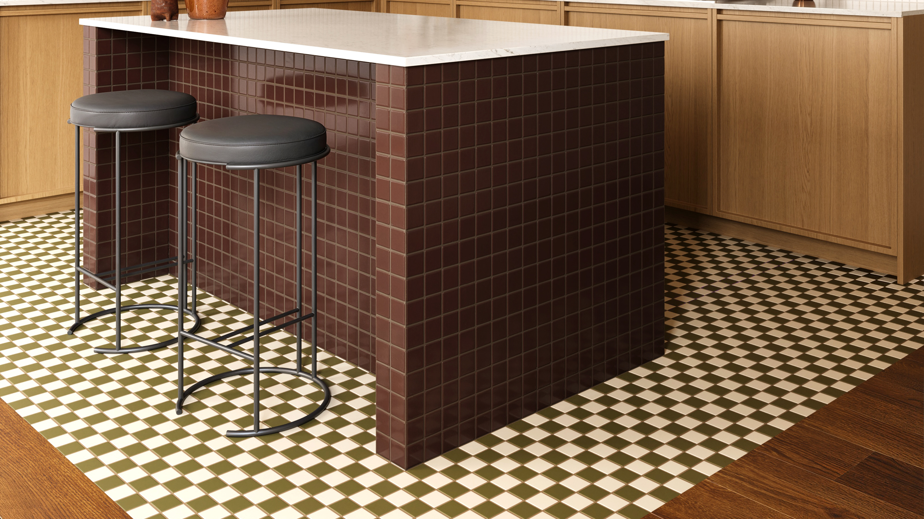 small kitchen with wooden cabinets, a tile island, and a checkerboard tile rug beneath 