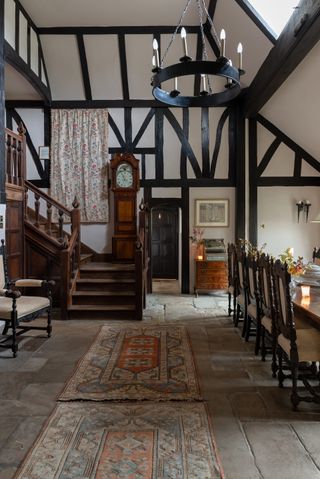 dining hall with William Morris tapestry and arts and crafts details in Elizabethan manor - Britain's oldest home