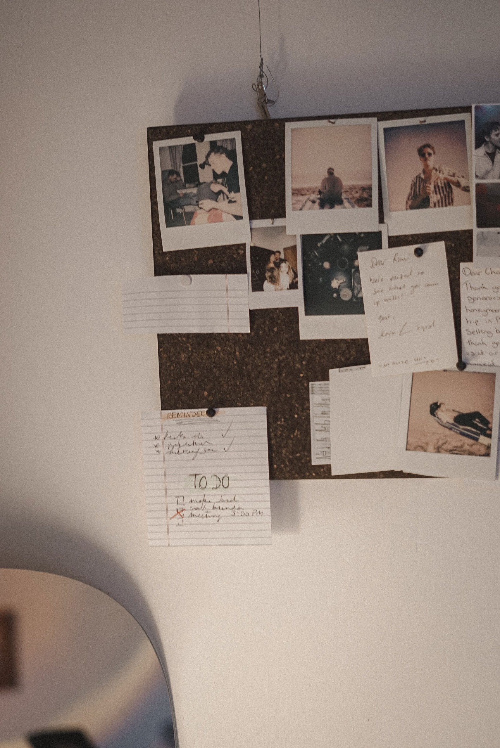 Elite - Polaroid photos and handwritten notes on cork board - TVS