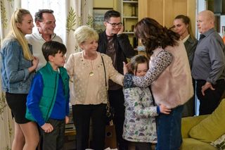 The Mitchell clan, including Dame Barbara Windsor as Peggy and young Grace as Janet Mitchell, hugged by screen mother Honey Mitchell played by Emma Barton (BBC)