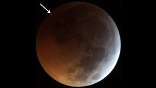 A meteorite hit the moon during a total lunar eclipse in January 2019, seen here as a bright flash.