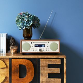 blue wall with radio and table