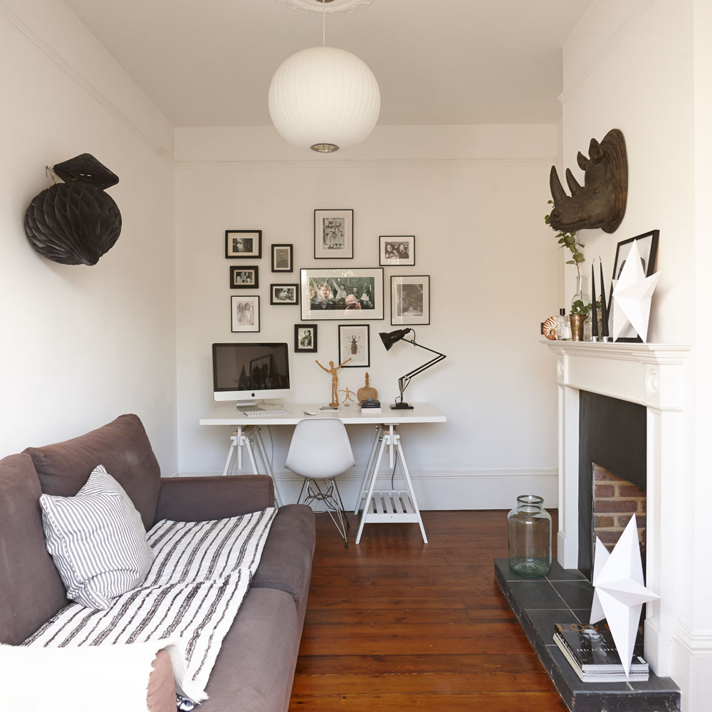 small white living room with home office