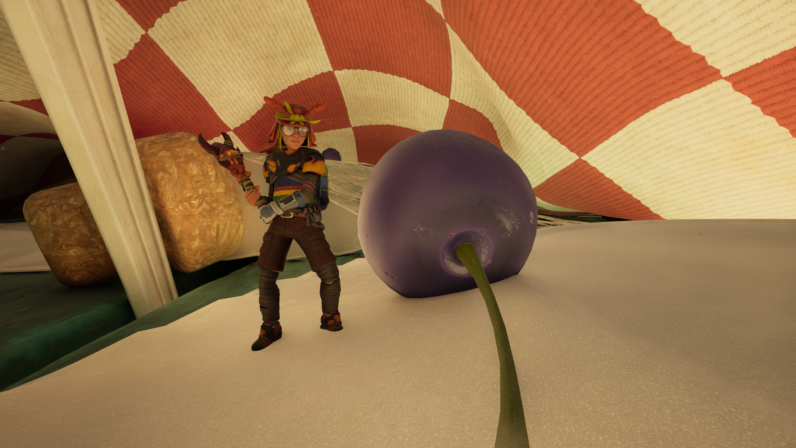 Grounded 2 blueberry leather chunks: A character wearing ant armour standing next to a blueberry under a picnic table cloth.