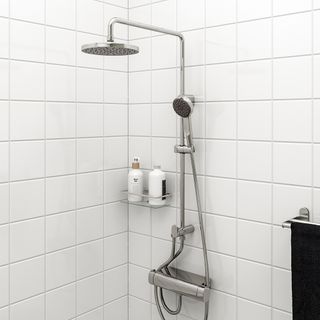 bathroom with white tiles on wall with shower