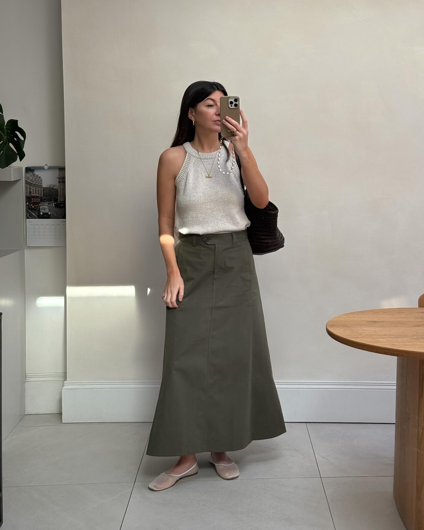 90s capsule wardrobe: @francescasaffari wears a khaki maxi skirt with a tank top and flats