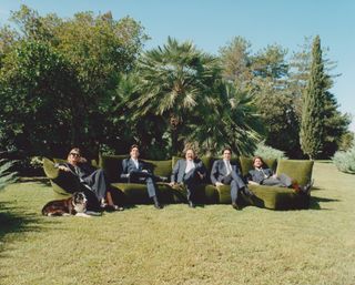 Monica, Niccolò, Valerio and Edoardo Mazzei and Umberto Manetti (with Blu) photographed at the Edra headquarters in Perignano with the brand’s ‘Standard’ sofa, designed by Francesco Binfaré