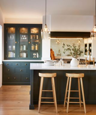 Glazed kitchen cabinets with warm lighting